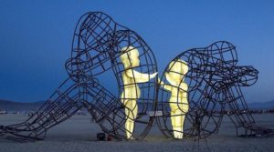 Inner Child Burning Man Sculpture. Children trapped within adult bodies.