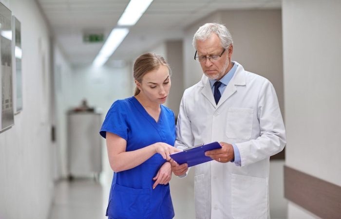 Nurse and Doctor looking over a chart.