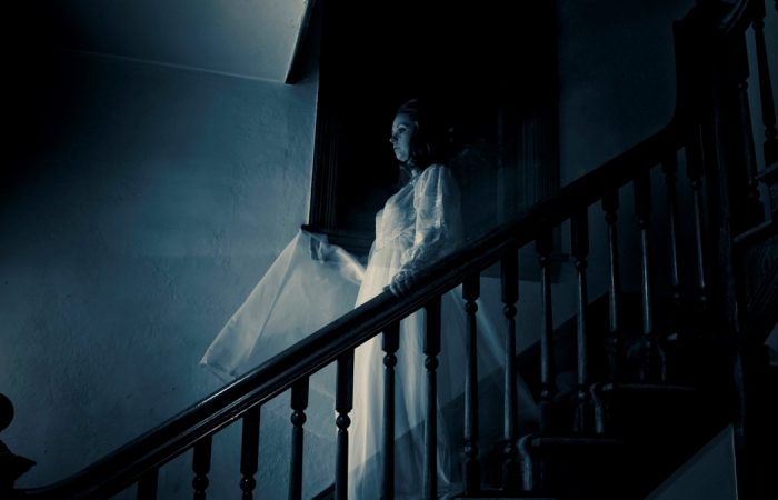 Ghost on stairway representing demonic entities