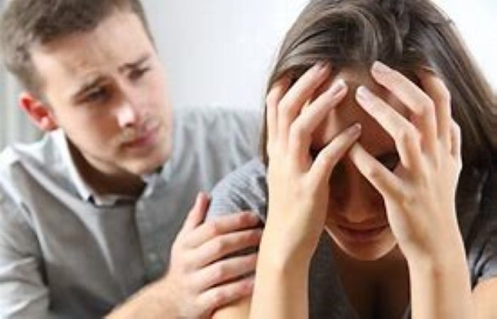 Man consoling woman who has demonic entities.